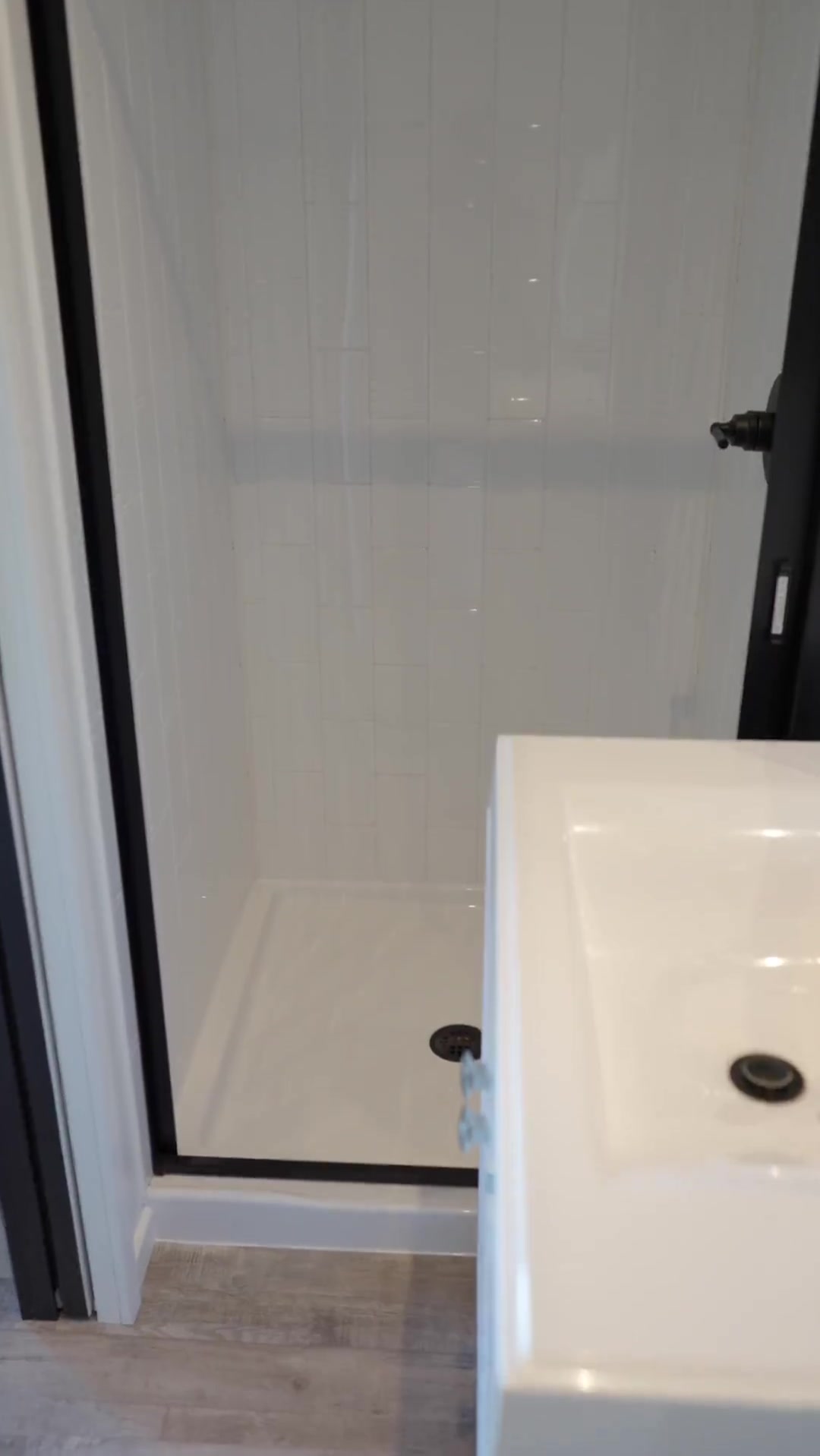 Shower enclosure and vanity in Mini-O's Sixteen BnB tour