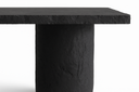 Detail of the Gemini table pedestal and chipped concrete slab edge