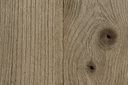 Close-up of the weathered reclaimed teak grain on the Mamagreen Aiko dining table base