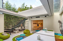 Renson Aero Skye integrated retractable roof over an outdoor dining terrace