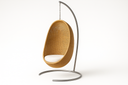 Sika Design natural hanging egg chair on a curved stainless steel floor stand