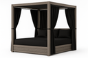 Sunset West Laguna King Lounge Bed, driftwood aluminum canopy daybed with black curtains and cushions, angled view
