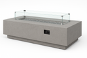 Sunset West Gravelstone concrete fire table with glass wind guard, angled view