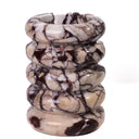 TOV layered Breccia marble vase polished veining closeup