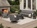 Ebel Siena wicker lounge set with quick-dry cushions beside an outdoor fireplace