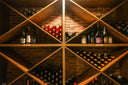 Wine display with diagonal timber shelving