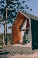 Modern A-frame modular home among trees