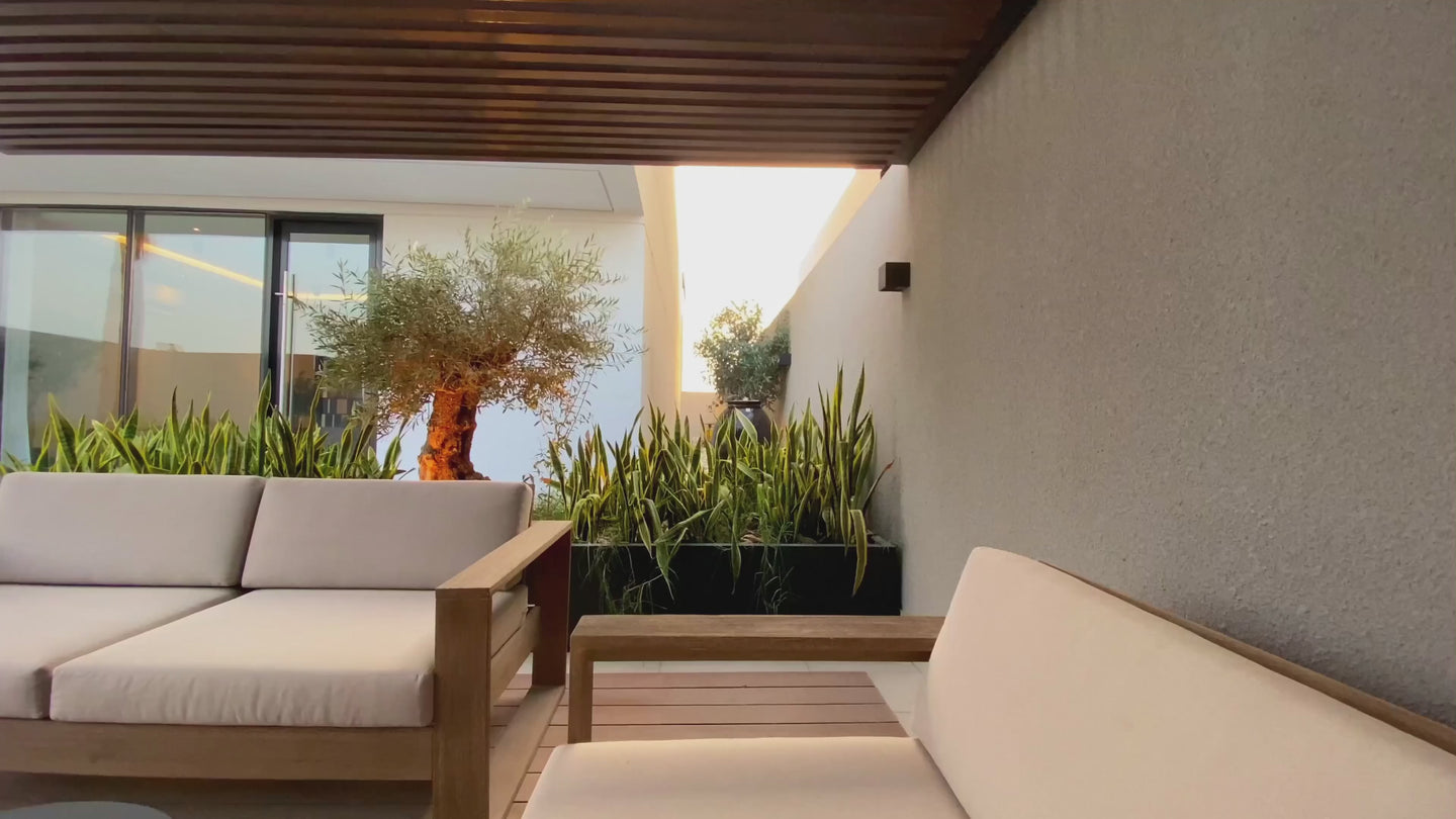 Outdoor lounge and fire feature at dusk
