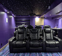 Luxury multi-row home theater beneath a fiber optic night sky