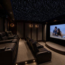 Luxury home theater with ceiling illuminated by fiber optic star points